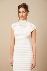 A woman wearing a horizontal striped tulle midi dress named Josephine with a fitted bodice and flowing skirt
