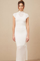 A woman wearing a horizontal striped tulle midi dress with a fitted bodice and flowy skirt in light pastel colors