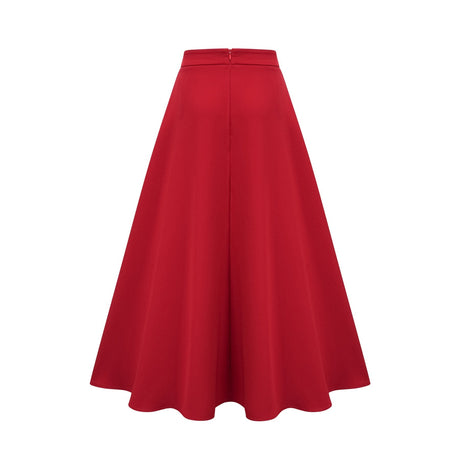 A woman wearing a matching red outfit consisting of a pleated blouse and skirt The blouse has long sleeves and the skirt falls to mid calf length The fabric appears lightweight and flowy