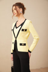 A woman wearing a matching set consisting of a knit cardigan vest and trousers with contrasting trim detail The set is called Eloise and features a coordinated look