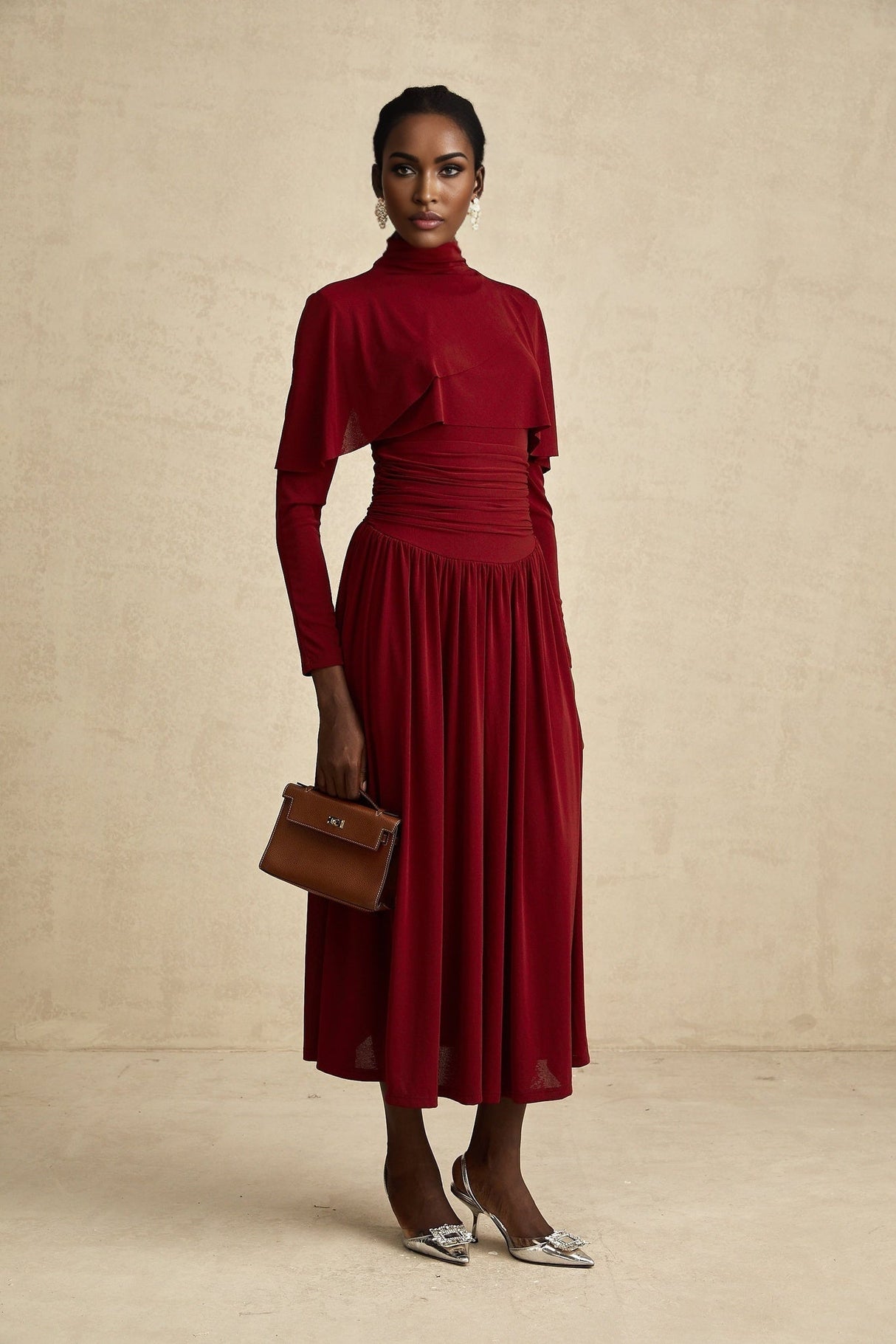 A woman wearing a red midi dress with ruched details and a flap design on the front