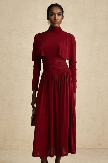 A woman wearing a red midi dress with ruching and a flap design detail