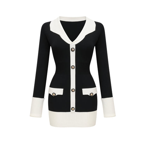 A woman wearing a short wool dress with color blocks in different shades and a ribbed knit texture The dress has long sleeves and a mini length silhouette