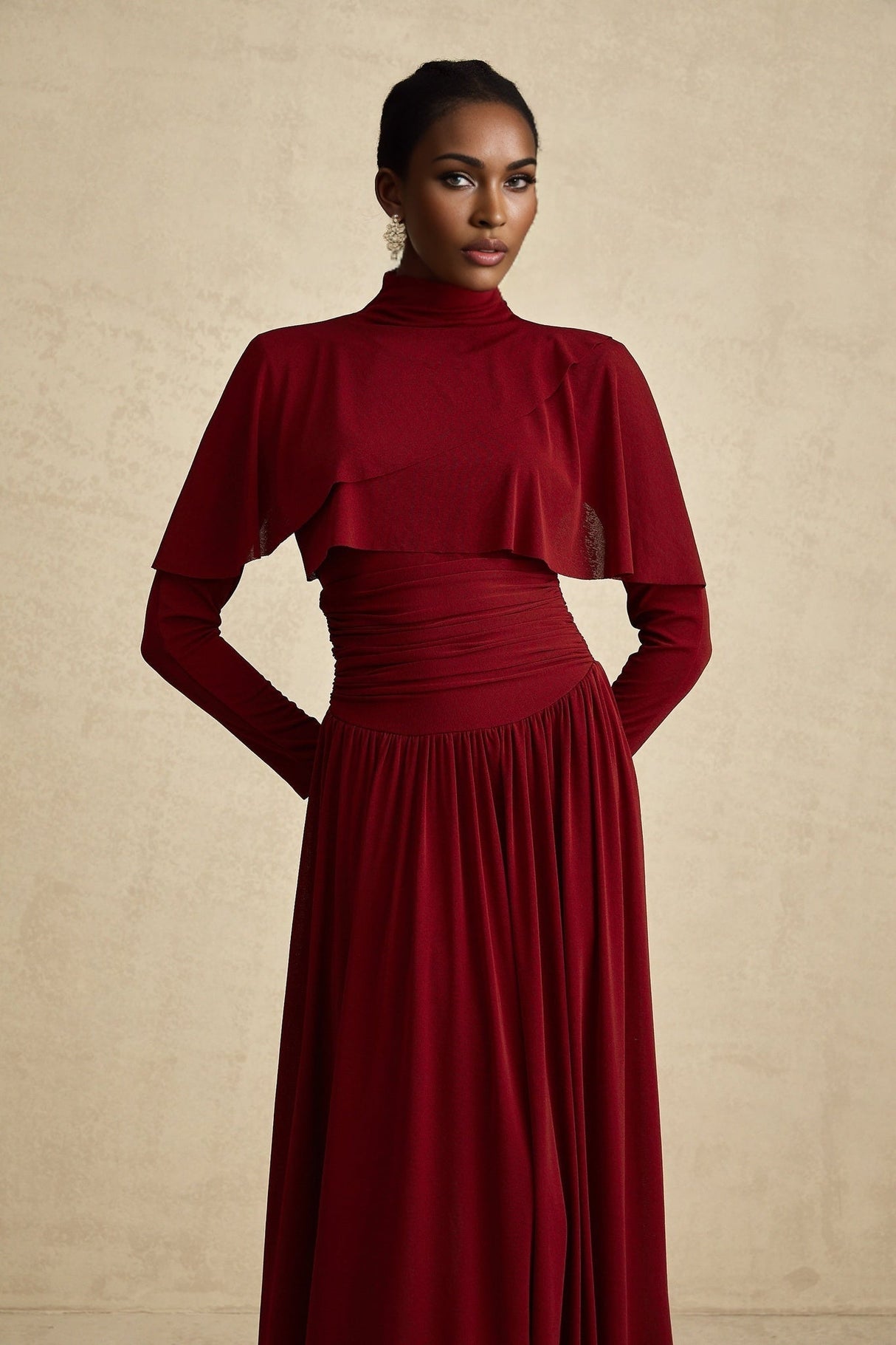 A woman wearing a vibrant red midi dress with ruched detailing and a flap design on the front