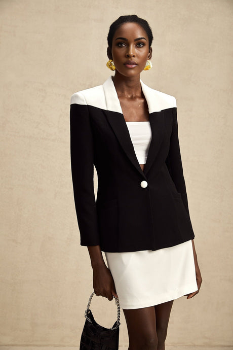 A womens matching set featuring a jacket and skirt in contrasting colors by the brand Honorine