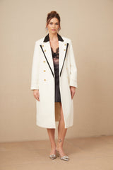 A wool blazer with color block design featuring terebentine hues long length and double breasted closure