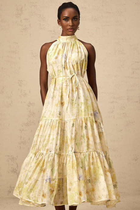 A yellow sleeveless midi dress with a floral print pattern called Ulani