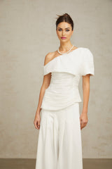 Adele white matching set featuring a creased top and trousers