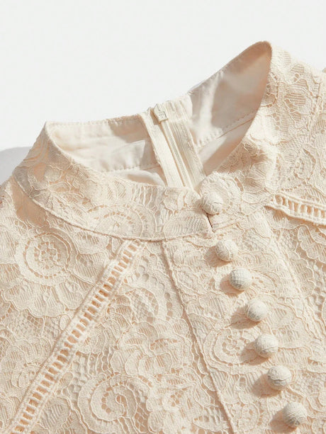 This elegant dress features a delicate lace overlay in a soft ivory hue, showcasing an intricate floral pattern that exudes.
