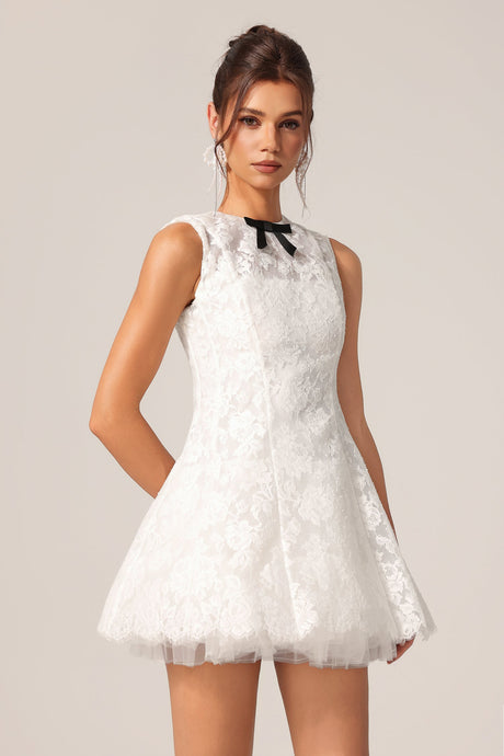 Ainsley White Lace Sleeveless Mini Dress Black Bowknot Flared Silhouette Lightweight Fabric Garden Party Cocktail Soiree Fashion Fun Playful Chic