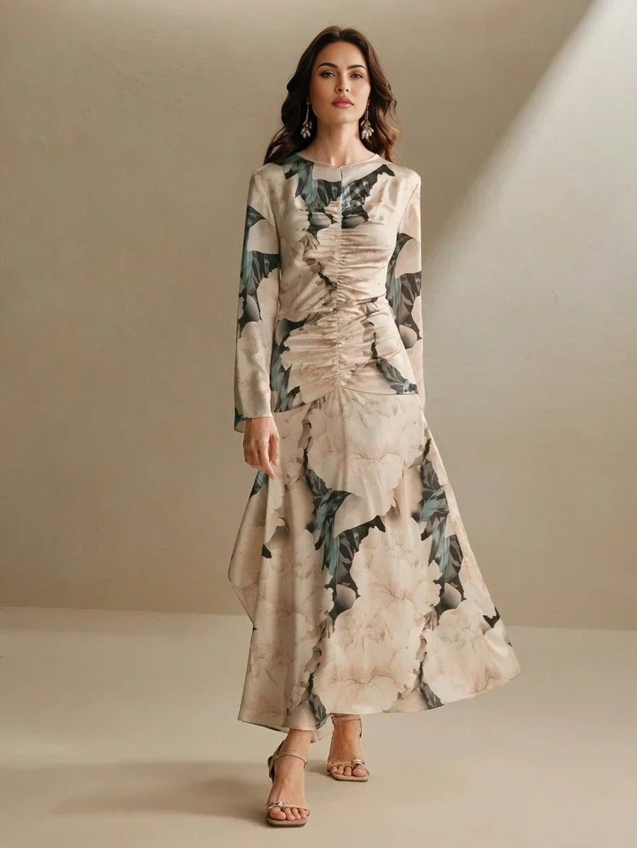 Elevate your wardrobe with this stunning long-sleeve dress, featuring a beautiful blend of soft beige and floral patterns in.