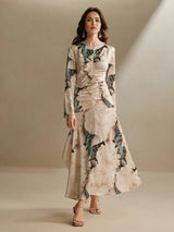 Elevate your wardrobe with this stunning long-sleeve dress, featuring a beautiful blend of soft beige and floral patterns in.