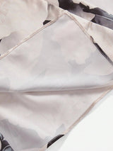 This elegant dress features a delicate blend of soft pastels adorned with a subtle floral pattern, expertly crafted from.