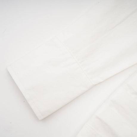 Alt text White pleated mini shirt dress with fitted waist by Orlane