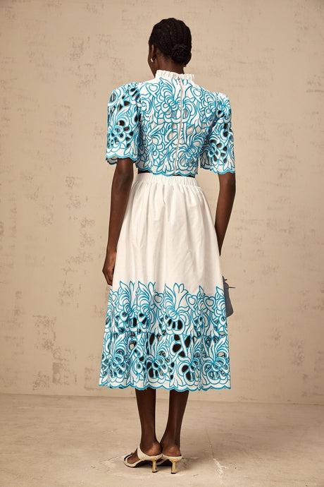Aurore blue two piece outfit featuring cut out details and embroidery on both top and skirt