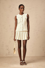 Beige knit vest top and skirt set with sequin embellishments matching outfit named Helene