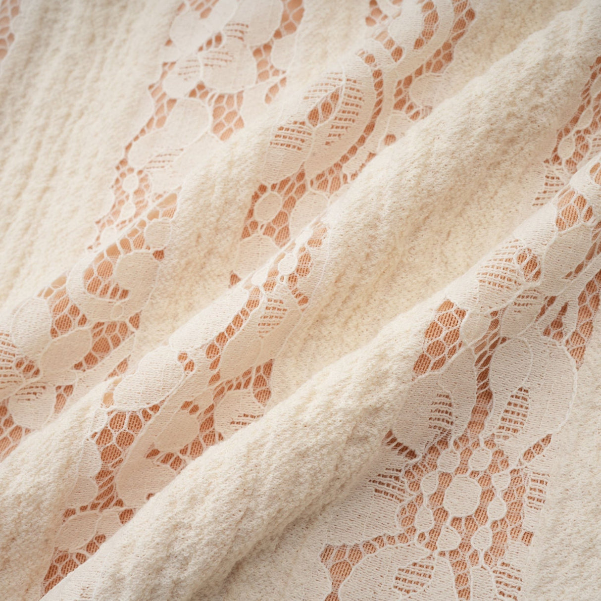 Beige mini dress with floral lace pattern and flared cuffs named Émeline