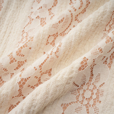 Beige mini dress with floral lace pattern and flared cuffs named Émeline