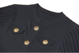 Black A-line dress with gold accents and pleated skirt