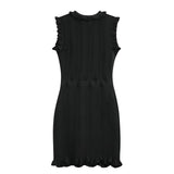 Black bodycon dress with textured wave pattern and ruffled collar and sleeves, ideal for parties or dinners