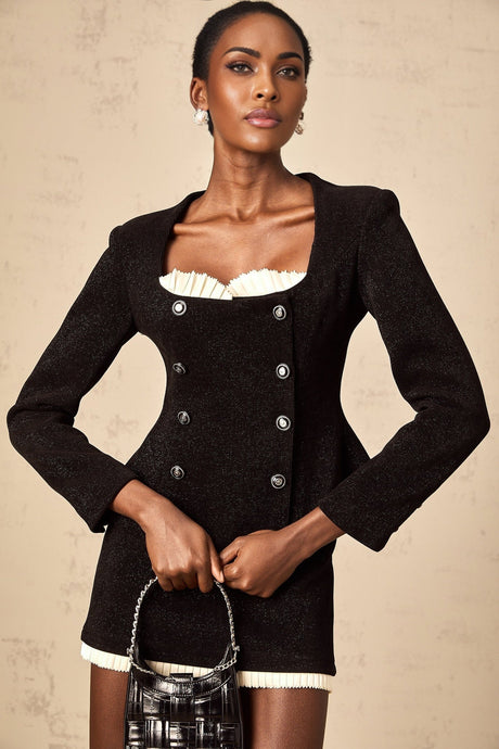 Black corduroy matching set featuring a panelled top and skirt in Hilaire style