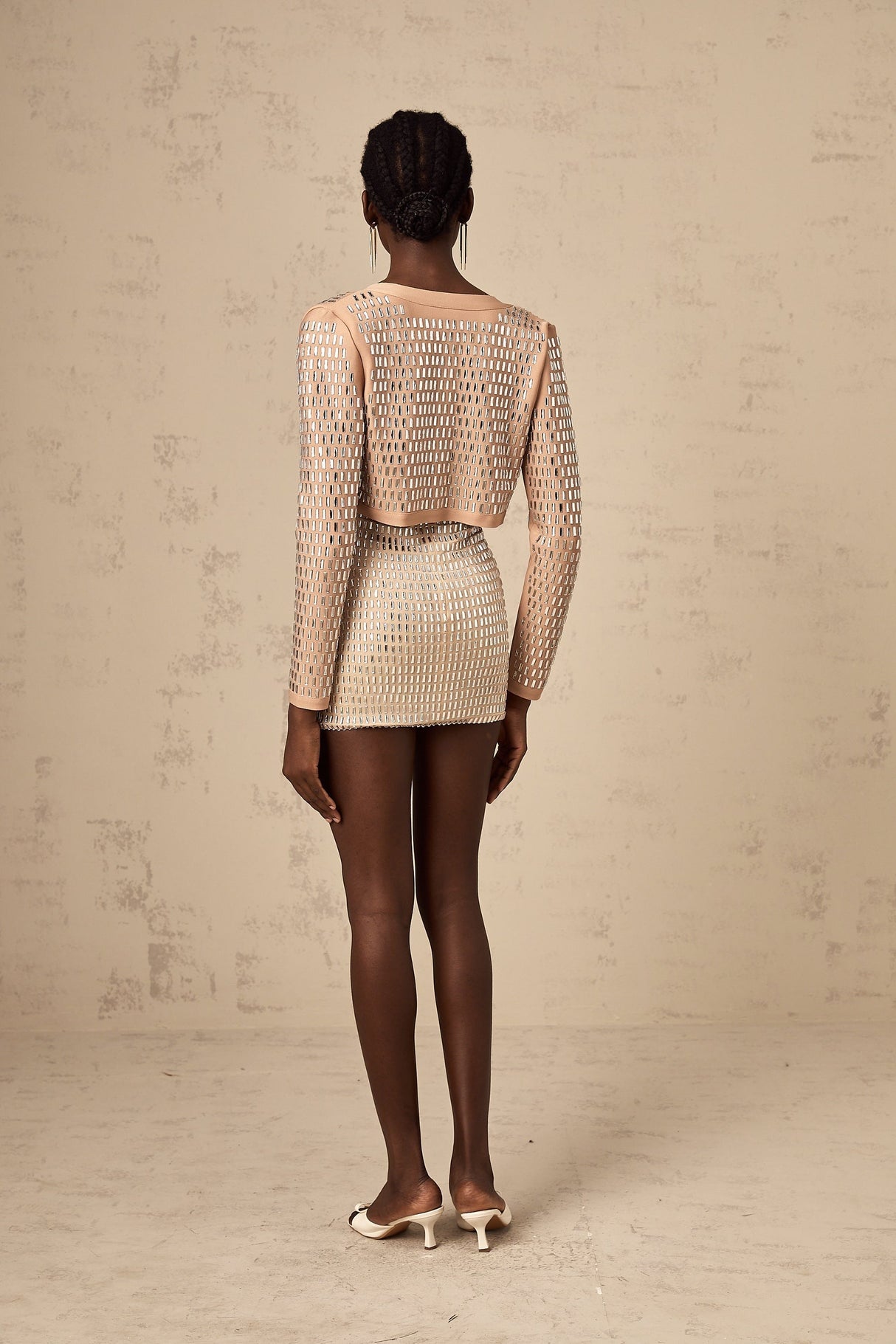 Black cropped jacket with silver studs embellishing the collar and lapels Ubalda design short sleeves and open front