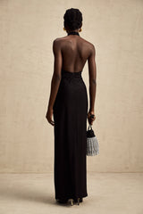 Black floral lace halter neck maxi dress named Camille featuring a long flowing skirt and delicate lace pattern