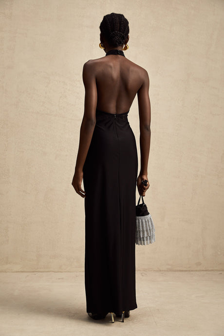 Black floral lace halter neck maxi dress named Camille featuring a long flowing skirt and delicate lace pattern