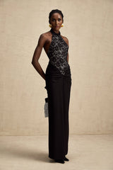 Black floral lace maxi dress with halter neckline and floral lace pattern named Camille