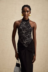 Black floral lace maxi dress with halter neckline and sleeveless design featuring allover lace pattern and floor length skirt