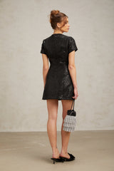 Black glittery mini dress with sparkly finish and short length