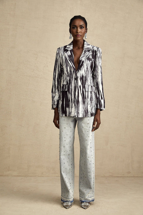 Black jacket with graffiti print design and textured fabric named Elise