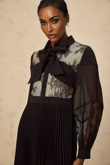 Black maxi dress with floral lace panels and pleated design named Segolene