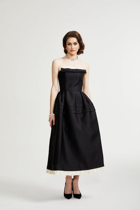 Black midi dress with bow detail front view on mannequin