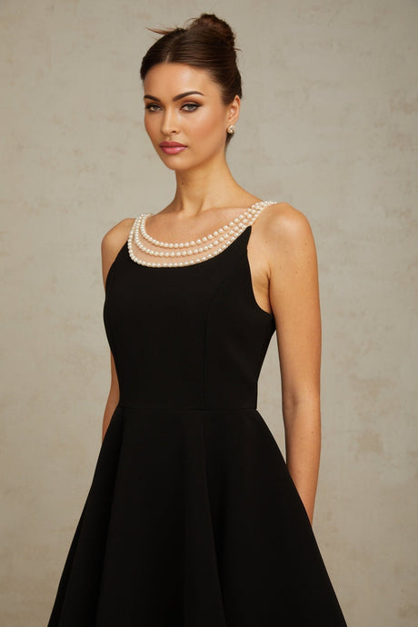 Black mini dress with faux pearl embellishments called Danae