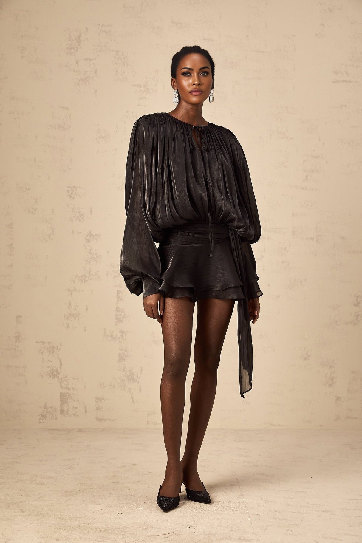 Black mini dress with full pleats and ruffles named Eugenie