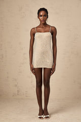 Black mini dress with silver stud embellishments and long sleeves