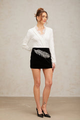 Black mini skirt with feather embroidery and embellishments called Myriam