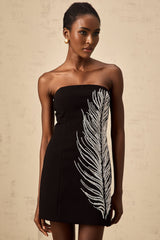 Black off shoulder mini dress with feather embellishments