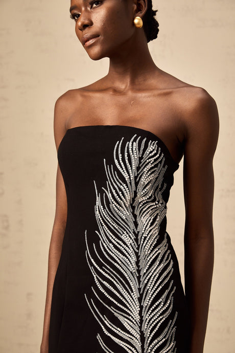 Black off shoulder mini dress with feather embellishments