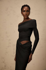 Black offshoulder midi dress with sheer elements and a flowing silhouette