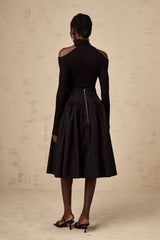 Black pleated midi skirt with flared silhouette named Pauline