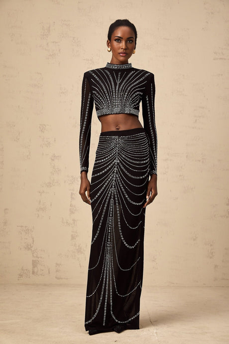 Black rhinestone mesh top and skirt set with matching pieces featuring sparkly embellishments on sheer fabric