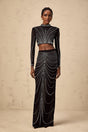 Black rhinestone mesh top and skirt set with matching pieces featuring sparkly embellishments on sheer fabric