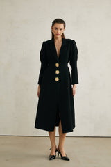 Black single breasted long coat by Aelle