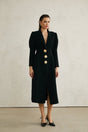 Black single breasted long coat by Aelle