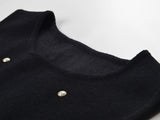 Black sleeveless dress with pearl embellishments and ruffle hem