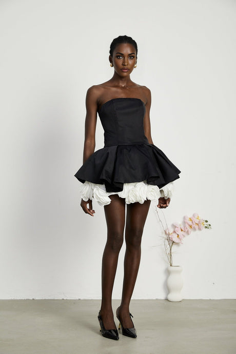 Black strapless corset mini dress with floral petal details named Lucie