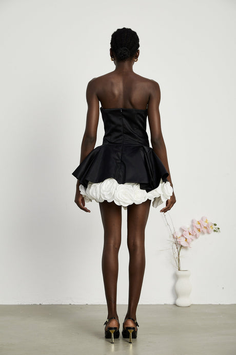 Black strapless corset mini dress with petal details called Lucie