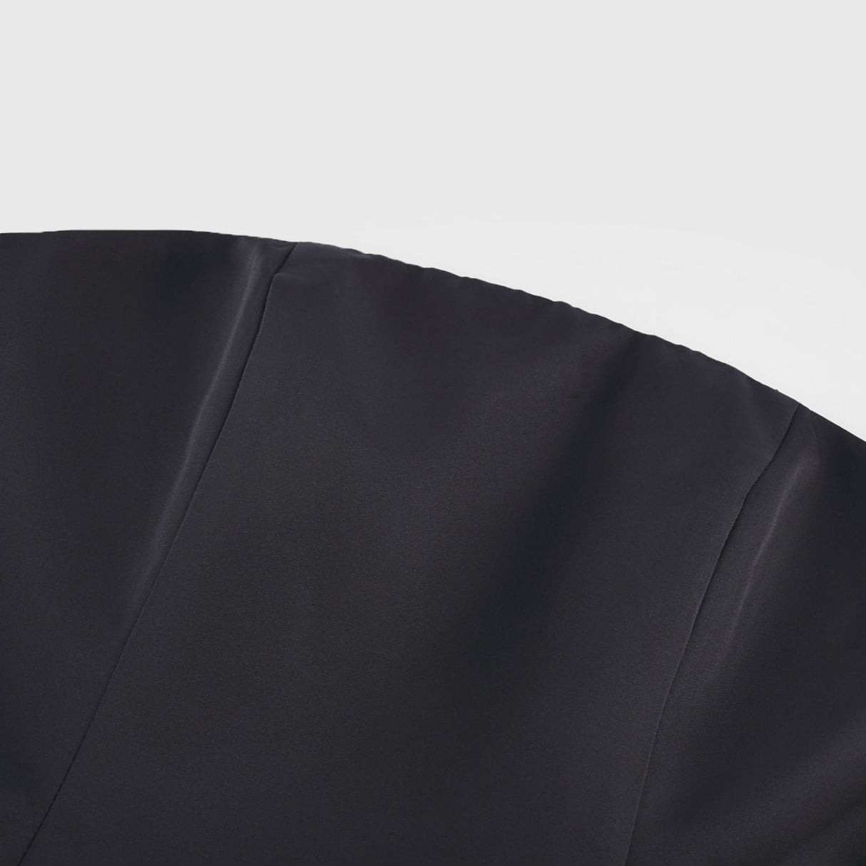 Black strapless mini dress with corset style and floral petal details named Lucie